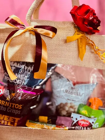 A close-up of the contents of a wedding room hamper. I select a mix of popular and gourmet snacks to please every guest.