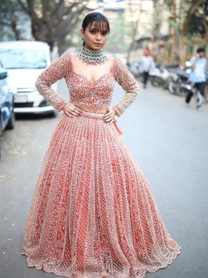 A confident pose in a gorgeous rental lehenga, perfect for any bridesmaid who wants to shine.