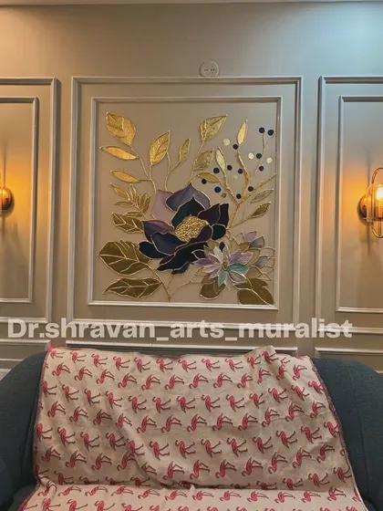 This art made even me stun and stare! A beautiful floral arrangement created with piping techniques and gold foil detailing, framed by classic wall molding. The wall sconces on either side make it a complete, elegant feature.
