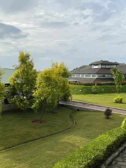 A view of the retreat's pathways and manicured lawns. We take great care in maintaining our grounds to ensure they are always a beautiful and welcoming space for our guests.