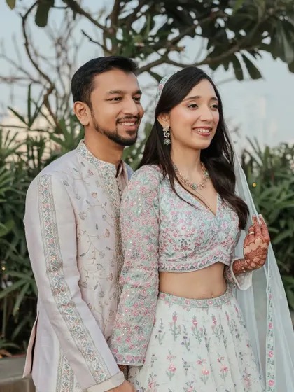 A lovely couple portrait. The bride's soft makeup look complements her pastel outfit and the natural daylight beautifully.