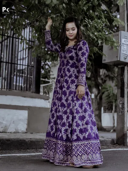 A full-length view of the purple brocade Anarkali, a perfect blend of tradition and modernity.
