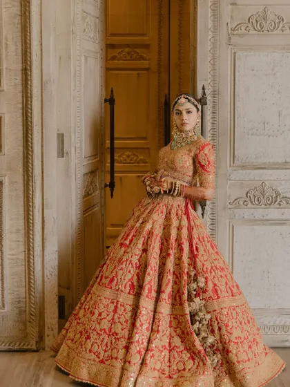 The Queen. A full-length shot of the bride in her stunningly detailed lehenga, exuding grace and poise. This is the royal aesthetic I bring to life.