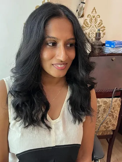Shruthi's hair looks healthy and full of movement.
