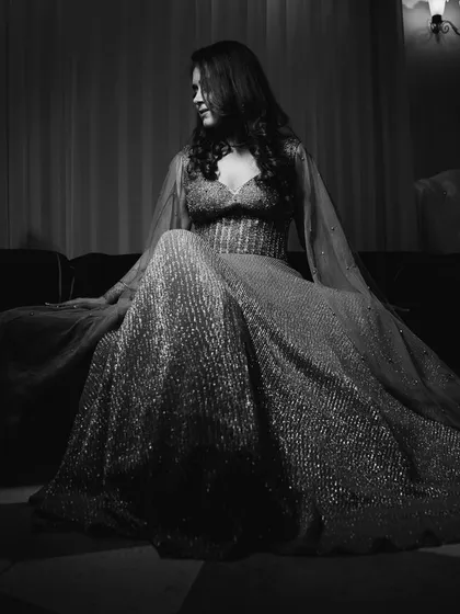 A glamorous black and white portrait of the bride, Simrita, on her cocktail night, looking like a star from a classic film.