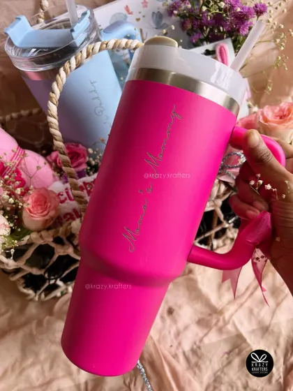 A personalized hot pink 'Mama & Mommy' sipper, a stylish and practical gift for a same-sex couple expecting a new baby.