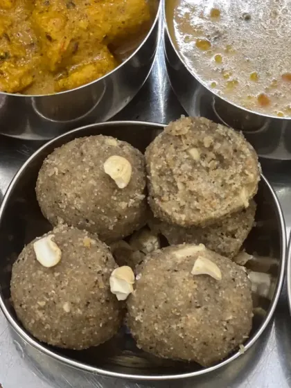 Our Churma Ladoos, made from coarsely ground wheat, ghee, and sugar, and topped with cashews.