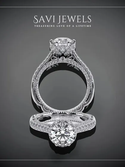 This design is a masterpiece of detail, featuring a central brilliant diamond held within an intricately crafted halo and band. It is a ring designed for a love story that is grand and beautiful.