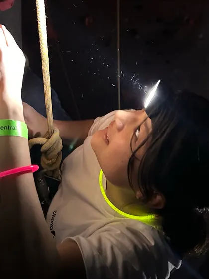 A climber navigates a route by headlamp. Night climbing challenges your senses and makes familiar walls feel like a brand new adventure.