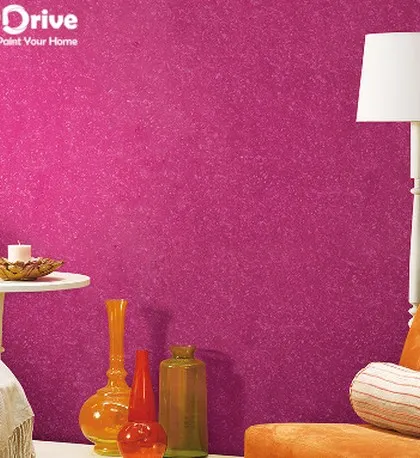 This image showcases a vibrant pink textured wall in a styled living room setting. A bold texture like this can serve as the main design feature, adding personality and energy to the space.