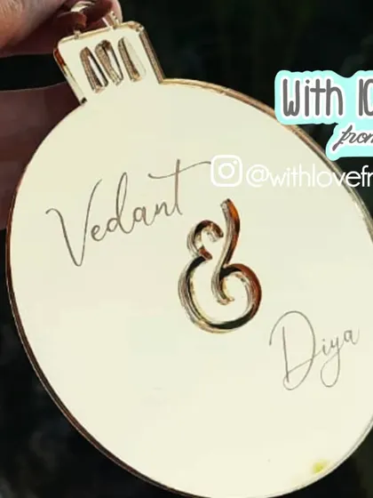 A simple and elegant ornament celebrating a couple. I can engrave two names connected by a beautiful ampersand, making it a lovely gift for a first Christmas together or an anniversary during the holidays.