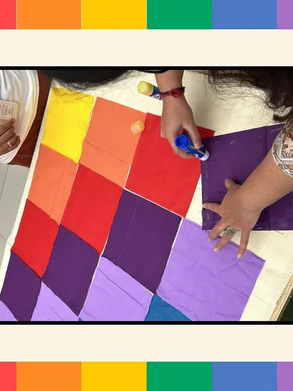 The hands-on process of assembling the Pride quilt. This tactile activity is a great way for team members to connect and create something tangible together.