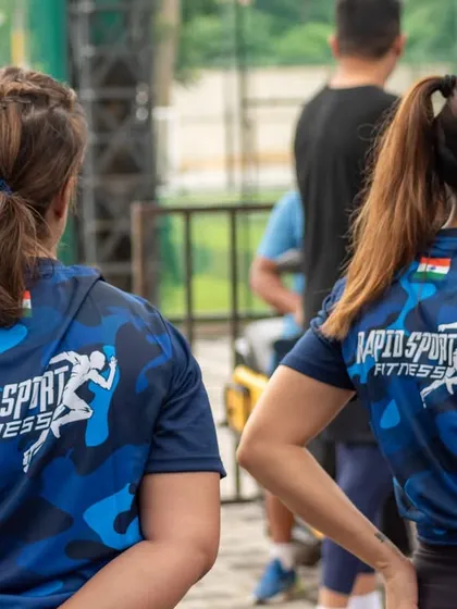 Two members of our community at the Independence Day event, proudly wearing our team apparel. This sense of belonging and shared purpose is at the heart of what we do.