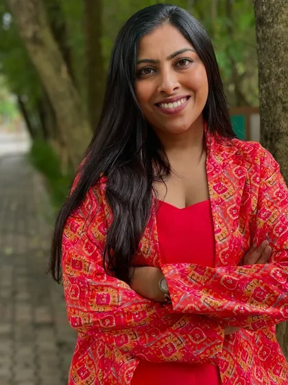 A confident smile during a team-building offsite. As a facilitator, I create a comfortable and inclusive environment where everyone feels encouraged to participate.