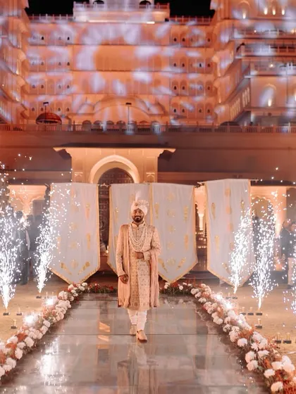 Your royal entry awaits. We specialize in designing grand, jaw-dropping entries for grooms against majestic backdrops like this palace, making it a moment fit for a king.