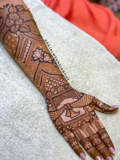 A lovely floral bridal design with a large central flower on the back of the hand and delicate patterns on the palm.