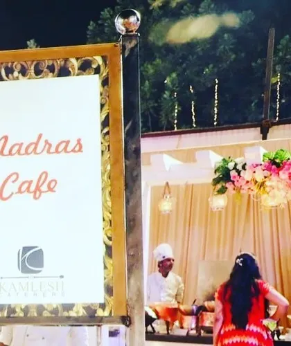 A sign for our "Madras Cafe" station, where we serve authentic South Indian delicacies. This is part of my commitment to bringing diverse regional Indian flavors to your event.