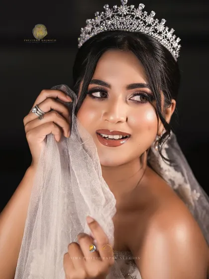 Another joyful and candid shot of the bride with her veil, a perfect memory from a perfect day.