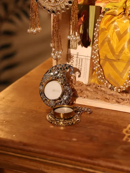A stunning paisley-shaped mirror-work diya, a centerpiece in one of my premium Diwali hampers.