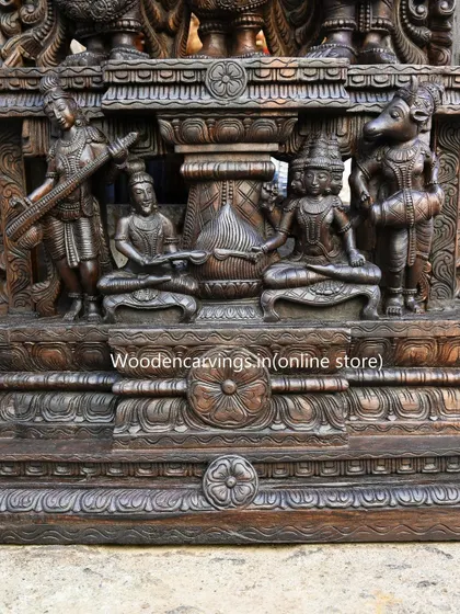 The base of the 87-inch Thirukalyana sculpture features smaller, exquisitely carved figures of celestial musicians and attendants, demonstrating that no detail is too small for our attention.