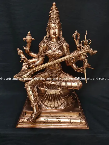 A finished bronze sculpture of Matangi, the Tantric form of Goddess Saraswati. She governs speech, music, and the arts, and is shown here playing the veena, a stringed instrument.
