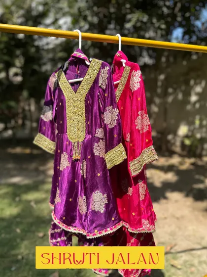 This image shows my Gota Patti sharara sets in both purple and pink. The rich colors and opulent embroidery make them a standout choice for any grand festive occasion.
