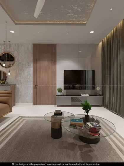 This living room design uses a neutral color palette and a mix of textures, including a patterned ceiling and a glass coffee table, to create a calm and sophisticated atmosphere.