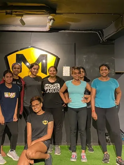 More of our incredible female members posing after a tough workout. The community vibe is strong with this crew.