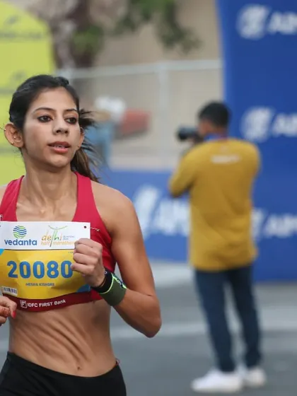 A close-up action shot from the Vedanta Delhi Half Marathon. This shows the intensity and focus required for competitive racing, a skill I help my runners develop through structured training.