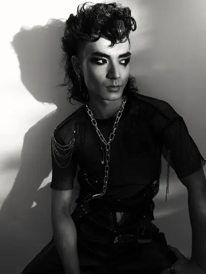 A seated portrait from the punk series, showcasing the full attitude and styling of the look.
