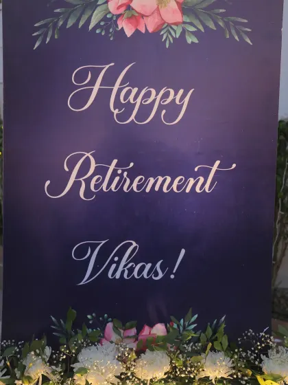 A personalized welcome sign for the retirement party, elegantly designed with a floral motif.