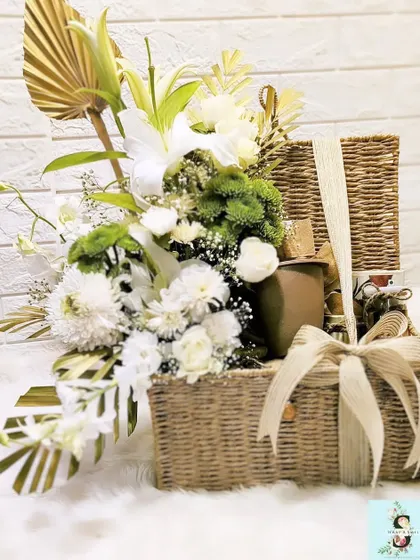 Another angle of the sustainable trunk hamper for Google, showing the lush arrangement of fresh white and green florals. The combination of a reusable basket and fresh flowers makes for an impressive and eco-conscious gift.