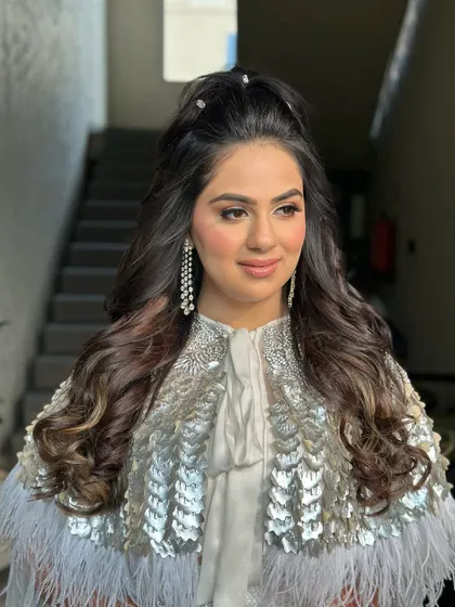 A close-up of the glamorous half-up style for a party.