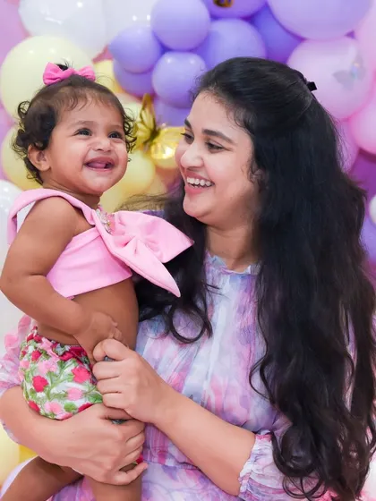 The look of pure happiness shared between a mother and her one-year-old daughter. These are the candid moments we love to capture.
