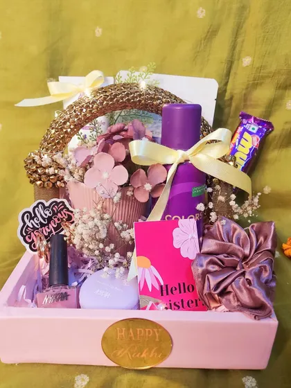 This beautiful leatherette gift basket is another great option for your sister or bhabhi. It's filled with beauty products, a personalized mug, and sweet treats.