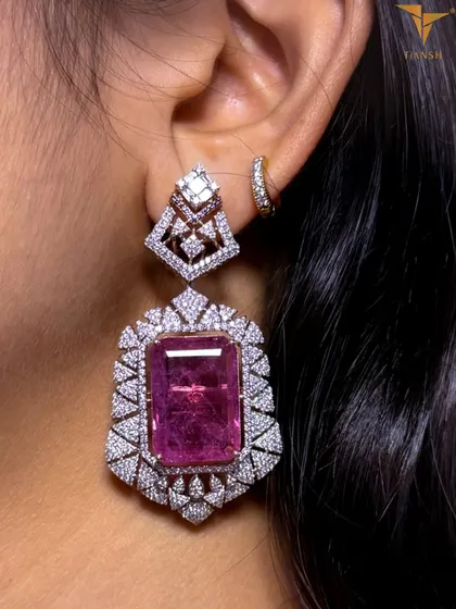 A closer look at the regal Tiansh earrings. The striking pink gemstone is surrounded by a halo of diamonds, echoing the grace and grandeur of heritage in a modern design.