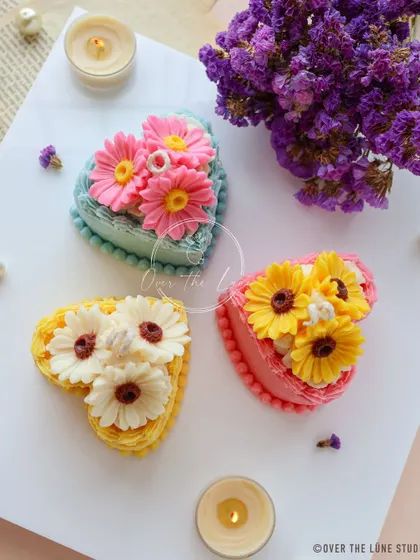 These heart cake candles are topped with beautiful daisy and sunflower designs. They combine my love for florals and cute desserts into one perfect little gift.
