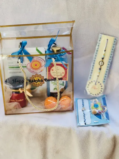 A simple and elegant Rakhi gift bag with matching rakhis, perfect for a coordinated gift.