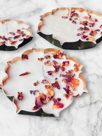 A beautiful display of candles made in my lotus-shaped urlis and decorated with dried rose petals. This shows how you can combine my products to create a stunning final piece.