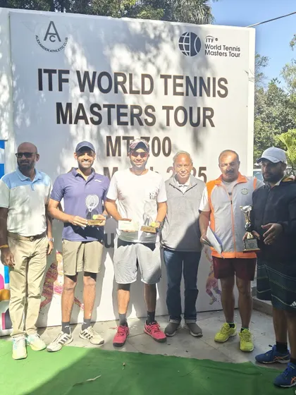 A group photo with fellow winners and officials at the ITF MT700 tournament. We respect our competitors and celebrate everyone's success.