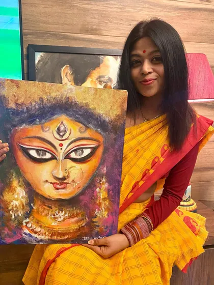 Holding my finished Durga Ma painting. Completing this piece just in time for the pujas is a tradition I cherish, connecting me to the festival no matter where I am.