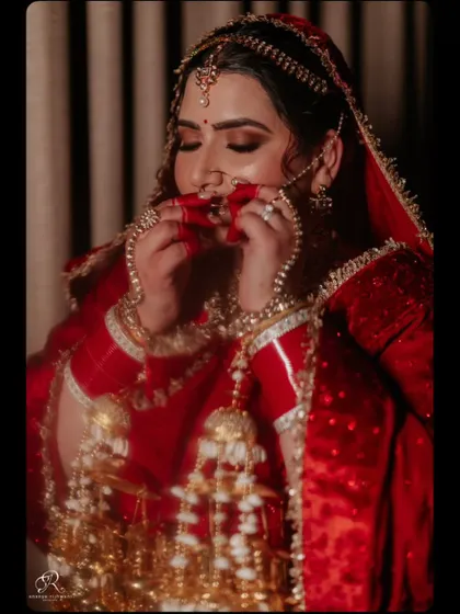 A moody and artistic bridal portrait, with beautiful lighting highlighting the bride's features and kaleerey.