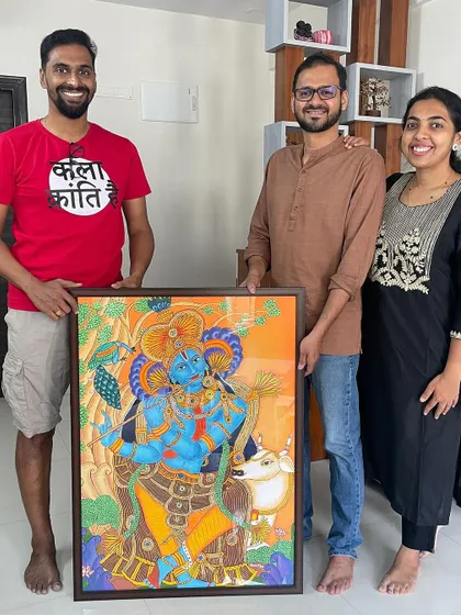 The best part of my job is seeing the joy on a client's face. Here I am with the wonderful couple who commissioned the Kerala mural of Lord Krishna. Creating art that holds personal meaning for you and becomes a cherished part of your home is what my passion is all about.