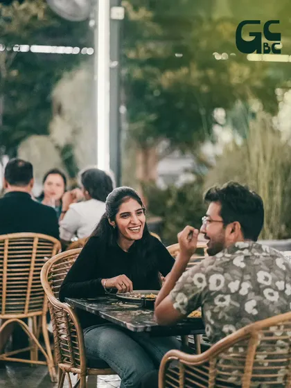 A happy couple enjoying a conversation at one of our outdoor tables.