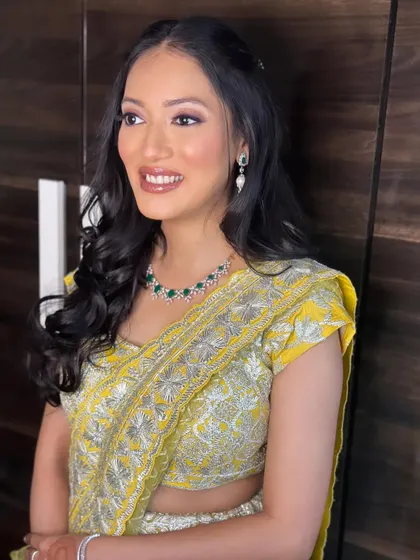 A final shot of this sunny and cheerful look. The makeup is designed to enhance her natural beauty and complement the bright outfit.