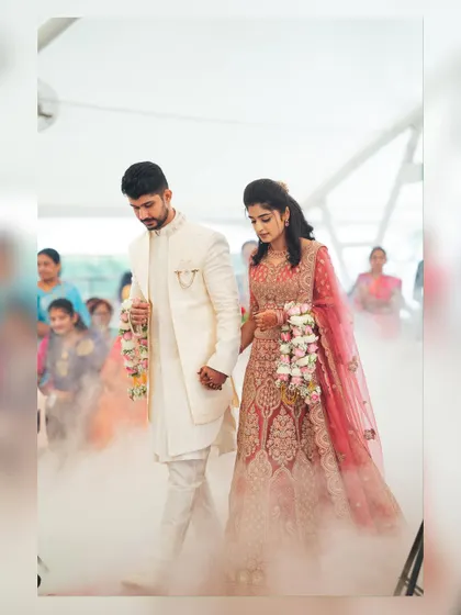 The couple makes a grand entrance through a fog effect we arranged. This is a popular choice for receptions to add a touch of drama and elegance.