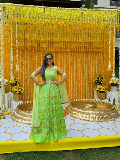 A full-length shot of my green and gold Anarkali, a perfect choice for a daytime Haldi function.