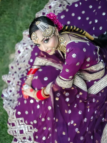 An aerial shot that captures the grandeur of the bridal lehenga and the artistry of the makeup. We teach students how to think about presentation for portfolio shoots.