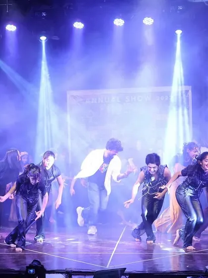 The stage filled with smoke and dramatic lighting as our students perform an intense piece of choreography.