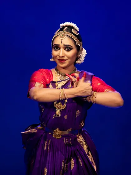 Meera Krishna's hands in a delicate mudra, a key element of Bharatanatyam's storytelling language.